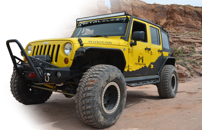 Yellow Jeep JL Wrangler with MetalCloak gear in the desert
